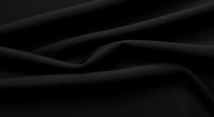 Obraz premium Fluid black fabric subtly rippled and folded casting soft shadows