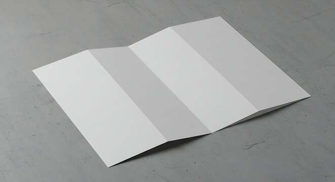 Unfolded blank flyer on a gray surface provides versatility for design projects