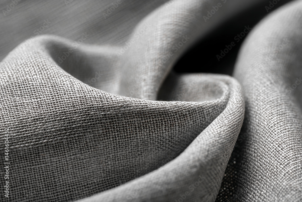 Poster close-up of gray fabric texture, showing woven detail, creating a rough and textured appearance, sym