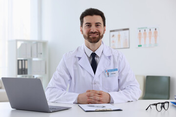 Fototapeta premium Professional doctor working at white desk in hospital