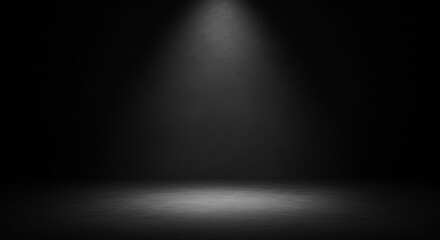 Dramatic spotlight illuminates a gritty dark and textured stage