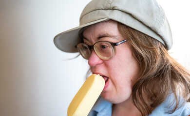 41 yo woman with the Down syndrome eating an ice cream, Tienen, Belgium
