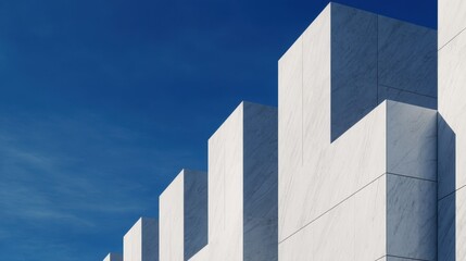 Modern architectural structure with geometric white panels against a blue sky backdrop