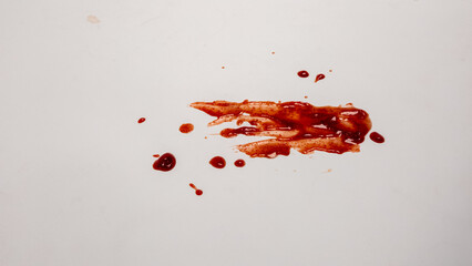 Blood Splatter on a White Surface Depicting Violence or Injury