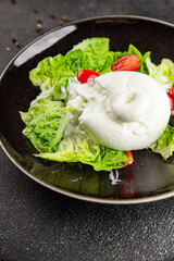 Burrata cheese salad buffalo milk cheese salad dish fresh delicious gourmet food background on the table rustic food top view copy space keto and paleo diet vegetarian