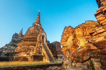 Ayutthaya temple pagoda and section of old wall, at the ancient Royal Palace complex,Thailand.