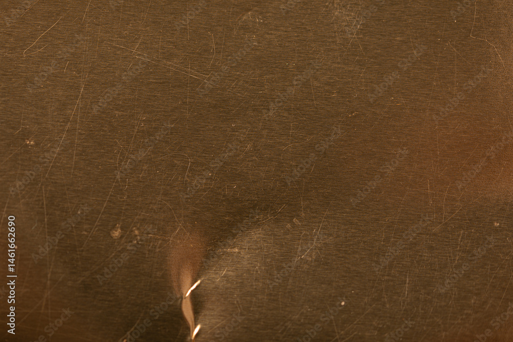 Poster High-resolution image of a scratched gold metal texture. Perfect for backgrounds and design projects.