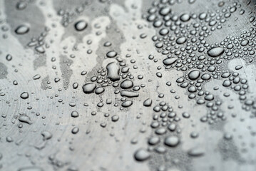 Photo of water drops on metal surface