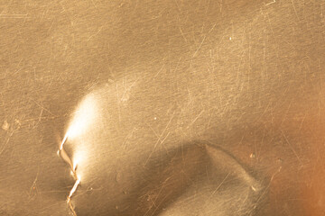 High-resolution image of a scratched gold metal texture. Perfect for backgrounds, design projects, and more.