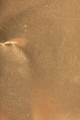 High-resolution image of a scratched gold metal texture. Perfect for backgrounds and design projects.