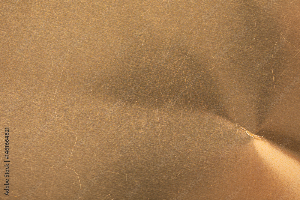 Poster High-resolution image of a scratched gold metal texture. Perfect for backgrounds and design projects.