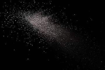 Obraz premium Abstract, light gray particles dispersed in a diagonal, streaking pattern on a black background