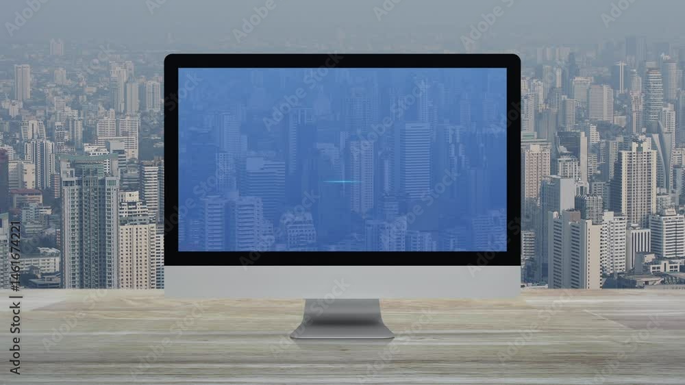 Poster play button on desktop modern computer monitor screen on wooden table over office building tower and