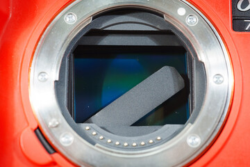 Broken camera shutter reveals sensor and internal components in detail