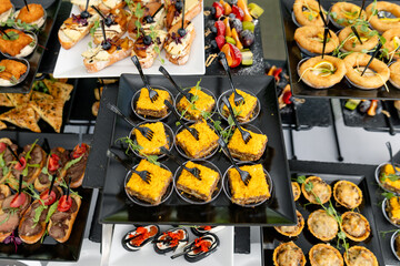 Catering plate. Assortment of snacks on the buffet table 