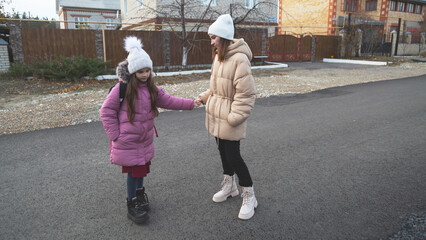 Mother accompanies the child to school.