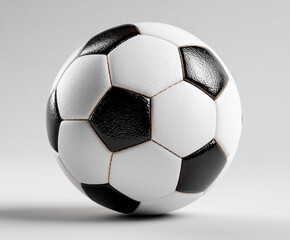 Close-Up of a Classic Black and White Soccer Ball on Plain Background