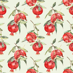 Seamless pattern, red pomegranates with seeds, leaves, tree branches on pastel green background. Hand drawn Watercolor illustration. For fabric, textile, wallpaper, wrapping, card, scrapbooking.