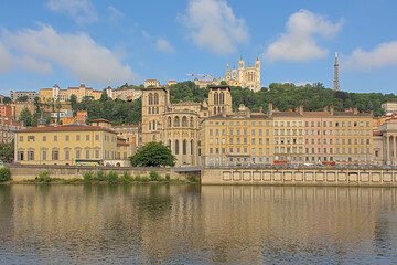 Fototapeta premium Borders of river Rhone, with Saint-Jean-Baptiste cathedral and of Basilica of Notre-Dame de Fourviere. Lyon, France 