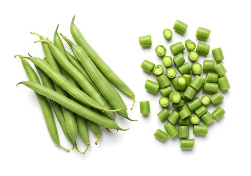 A top down shot of whole and chopped green beans on a white background in bright studio light