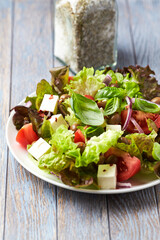 Salad with feta cheese and tomatoes. Close up.