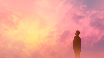 Obraz premium Silhouette contemplates the vibrant, dreamlike sunset, lost in thought against a canvas of pinks, purples, and golden hues.
