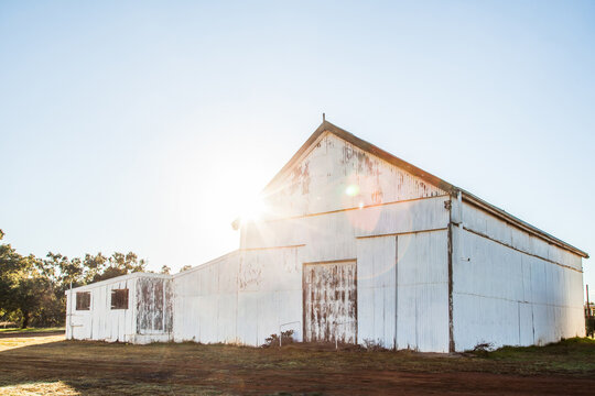 Sun flare over showground pavilion shed in rural country town