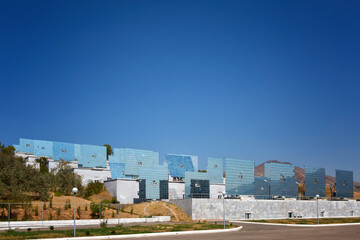 Solar furnace ( Sun Institute), second largest in world. View of giant sun concentrator on mountain and heliostats