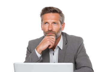 focused businessman contemplating while sitting behind laptop isolated on white background