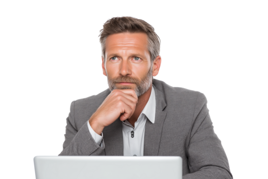 focused businessman contemplating while sitting behind laptop isolated on white background
