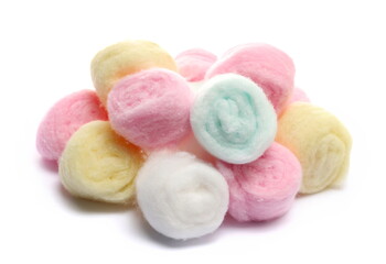 colorful cosmetic cotton balls isolated on white background, side view