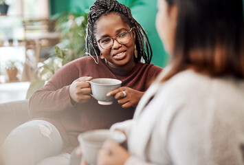Women, friends and relax with coffee on sofa for bonding with friendship, comfort and casual conversation. People, morning and warm beverage in afternoon with leisure, communication and happiness.