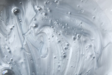 Texture of shower gel with bubbles, closeup