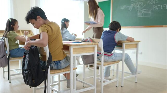 A schoolchild with rucksack to store vital stuff for class