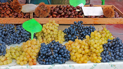 Organic raw ripe grapes fruit outside on a market stall
