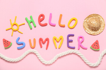 Obraz premium Composition with text HELLO SUMMER made of play dough, mini straw hat and rope on pink background