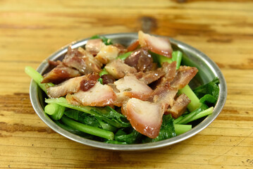 Honey Roasted Char Siu and Chinese flowering cabbage. Traditional Cantonese cuisine. Chinese delicacies.

