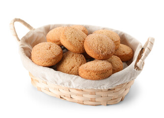 Wicker basket with sweet cookies on white background