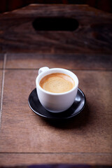 Cup of coffee on wooden background. Soft focus. Copy space	