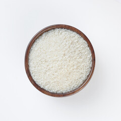 wooden bowl of rice isolated on white table