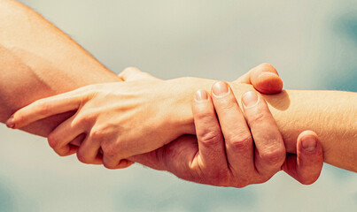 Helping hand. Hands of man and woman reaching to each other, support. Solidarity, compassion, and...