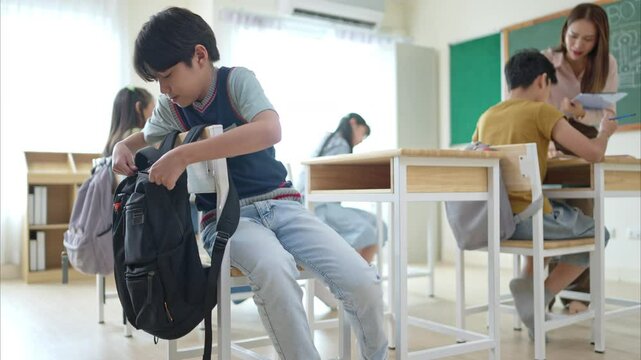 A schoolchild with rucksack to store vital stuff for class