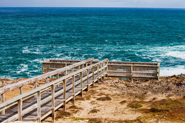 Lookout platform at Bridgewater Blowholes. Observation deck overlooking areas of crashing waterspouts at Cape Bridgewater on southwestern coast of Victoria, Australia. 