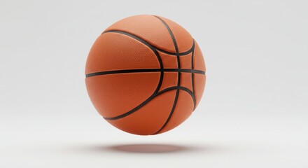 Fototapeta premium Brand new glossy basketball floating in air, shadow below, on white background
