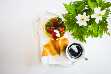 Mother's Day Breakfast setting with croissant and strawberries
