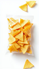Fototapeta premium Sealed plastic bag of golden tortilla chips against plain white background