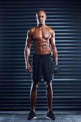 Fototapeta premium Muscle, African portrait and man with dumbbells for strong arms, health workout, body and exercise in gym. Topless athlete, bodybuilder and weightlifting challenge for confidence, power and wellness
