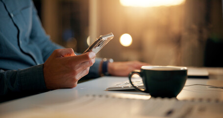 Hands, night and man with smartphone, business and coffee with social media, texting or internet. Closeup, evening or person in office, mobile user or cellphone with digital app, tea or communication