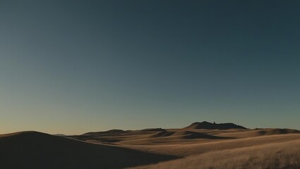 Fototapeta premium An atmospheric view of arid hills under a clear blue sky, conveying a sense of peace, expanse, and the raw beauty of untouched landscapes.
