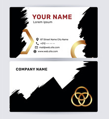 Modern black and gold business card template with brush stroke accents and geometric elements.